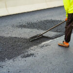 The,Highway,Construction,Site,Is,Paving,The,New,Asphalt,Pavement.