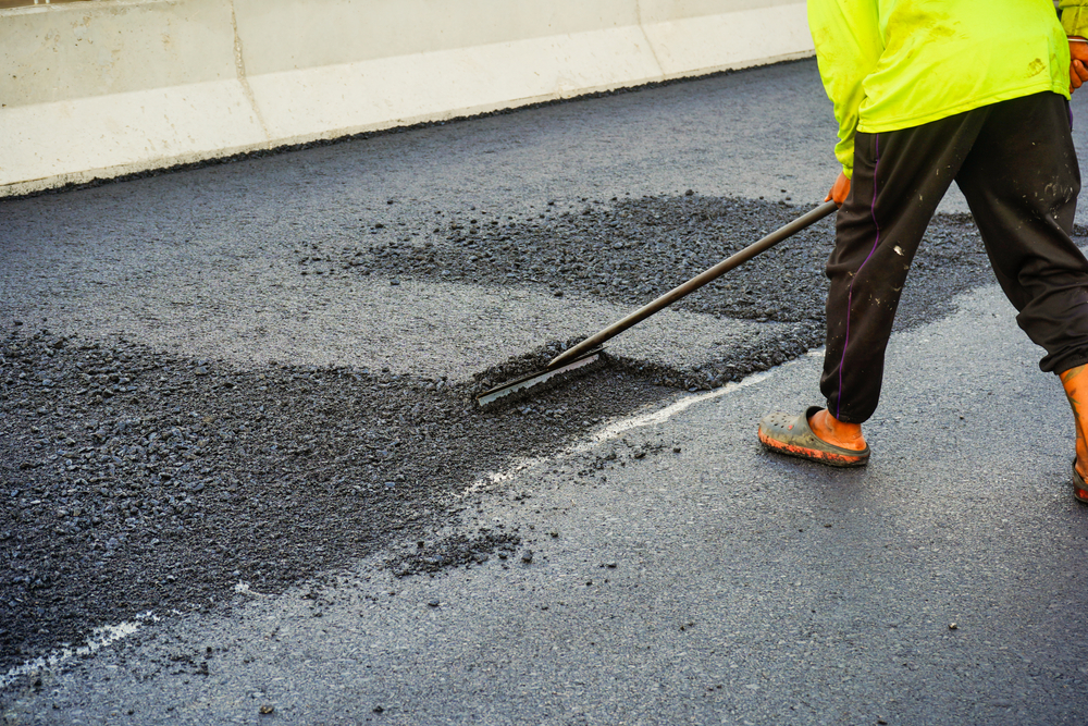 The,Highway,Construction,Site,Is,Paving,The,New,Asphalt,Pavement.
